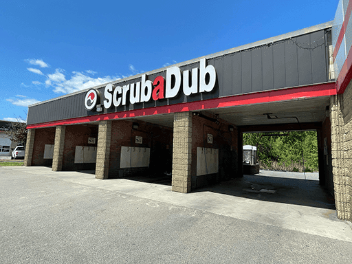 ScrubaDub Shrewsbury self-serve wash bays under a black and red fascia