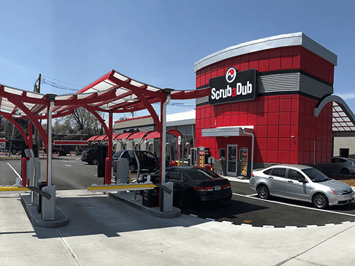 ScrubaDub Brighton car wash with its red tower and red pay-lane canopy