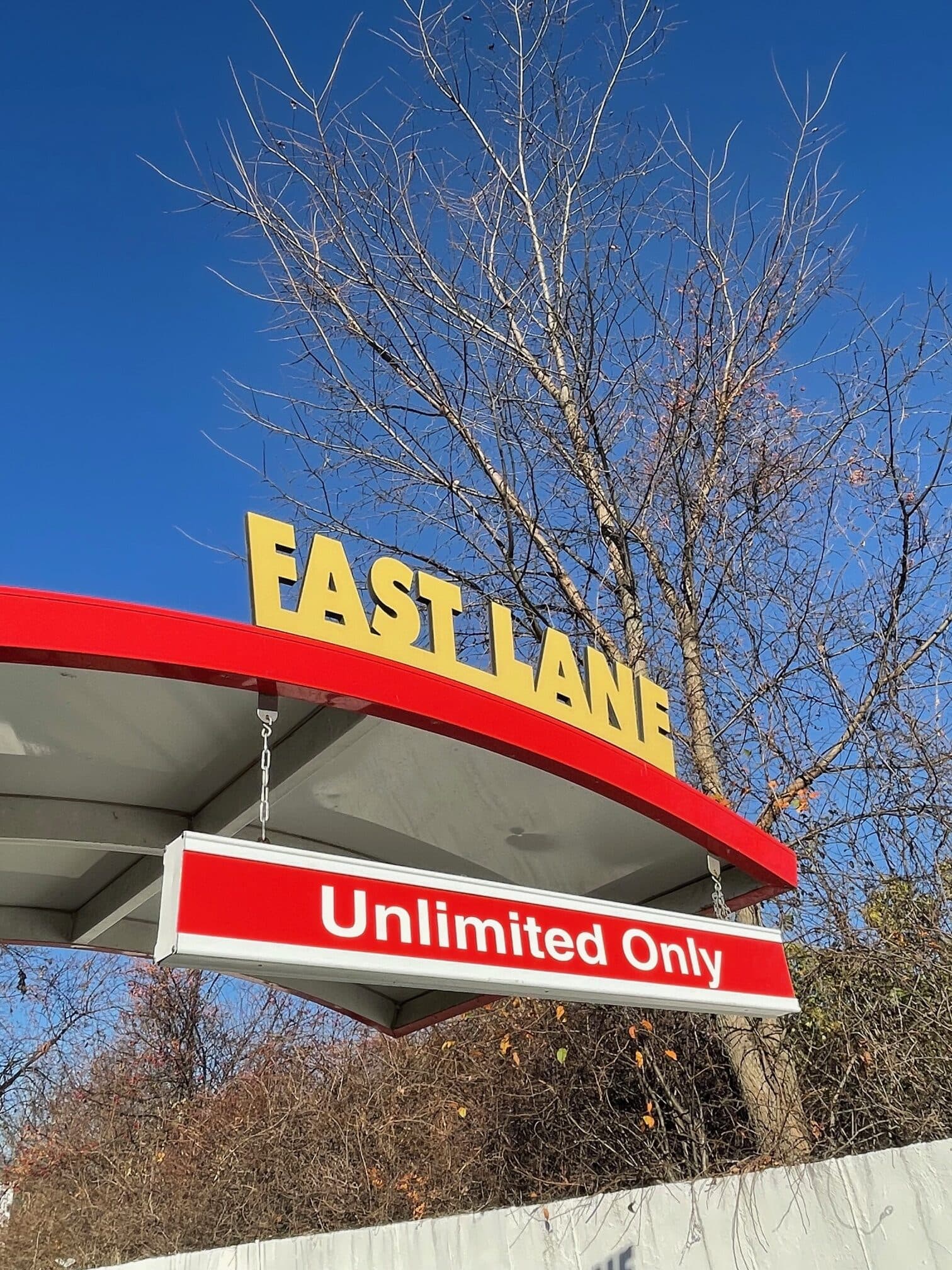 The Fast Lane canopy at ScrubaDub with its “Unlimited Only” sign