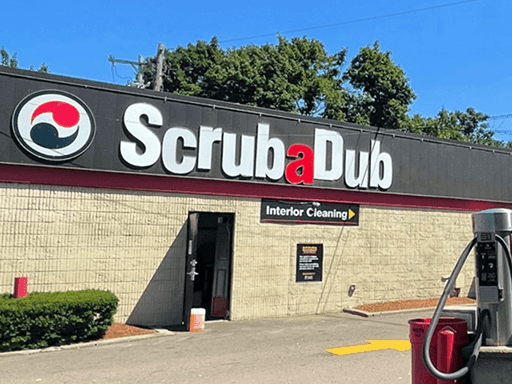 ScrubaDub Brookline building with its large logo sign over the Interior Cleaning entrance