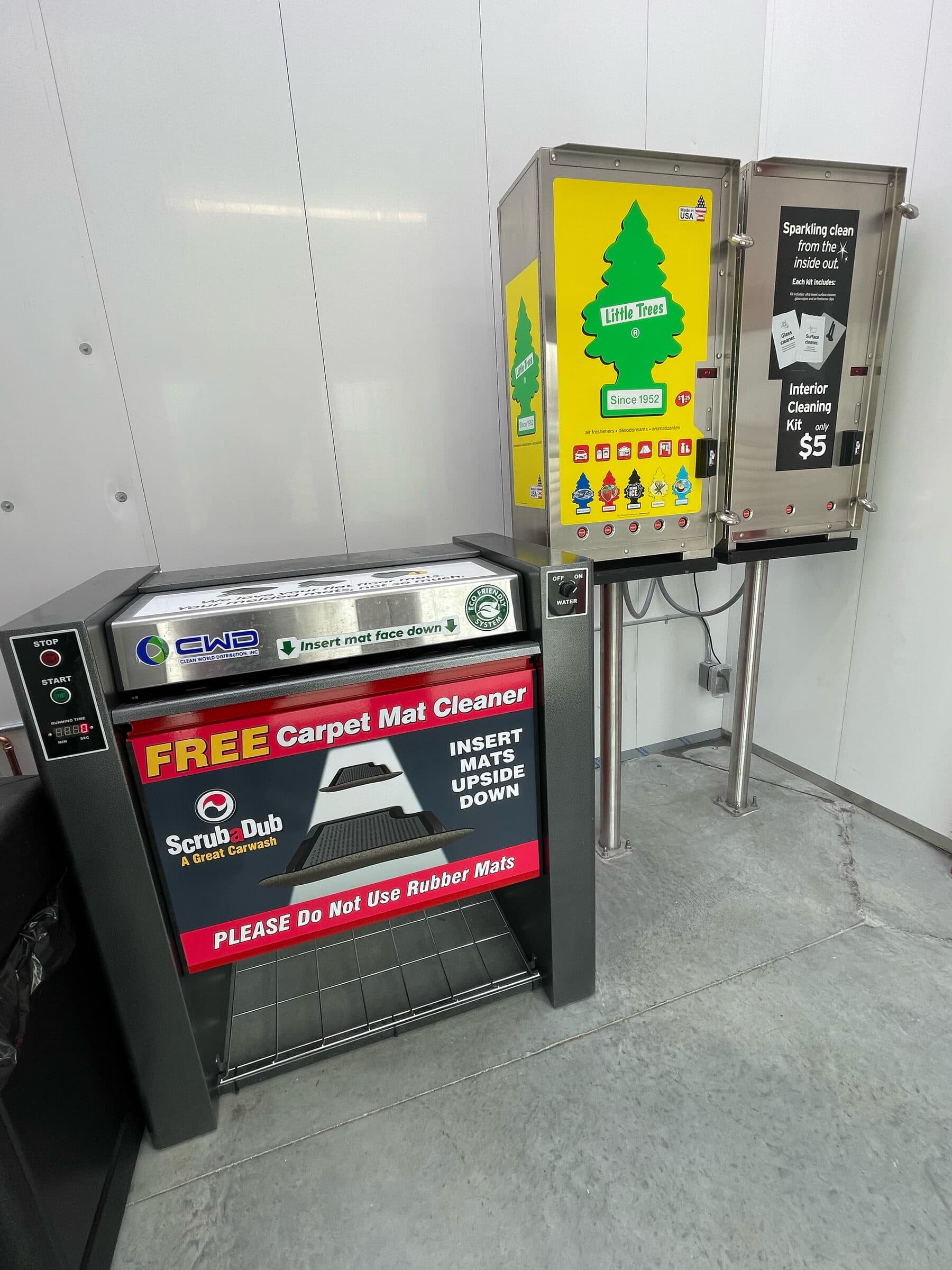 Free carpet mat cleaner machine next to air freshener and interior cleaning kit vending machines