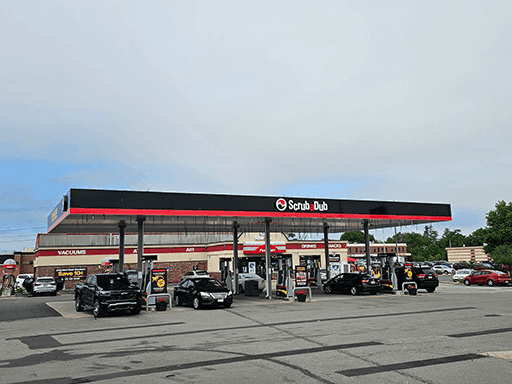 ScrubaDub South Portland gas station canopy with cars at the pumps